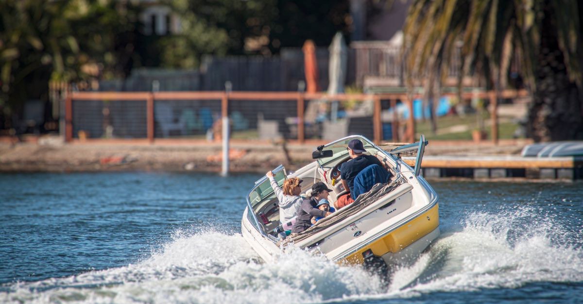 A family on a motorboat trip along the coast