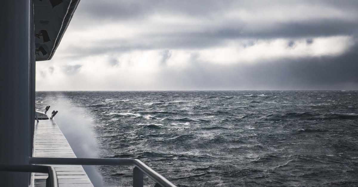 Rough sea with waves and a cloudy sky, seen from on board a ship