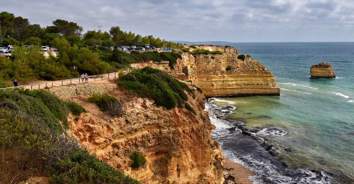 Rugged limestone cliffs dropping steeply into the Atlantic on the southern coast of Portugal